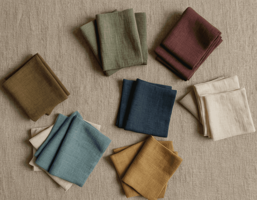 A visually appealing collage of sustainable fabric swatches—organic cotton, linen, hemp, and recycled materials—arranged artfully with natural light casting soft shadows.